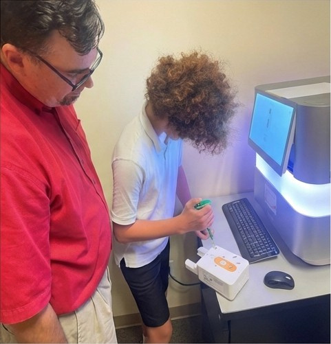 Harker students using DNA sequencing equipment